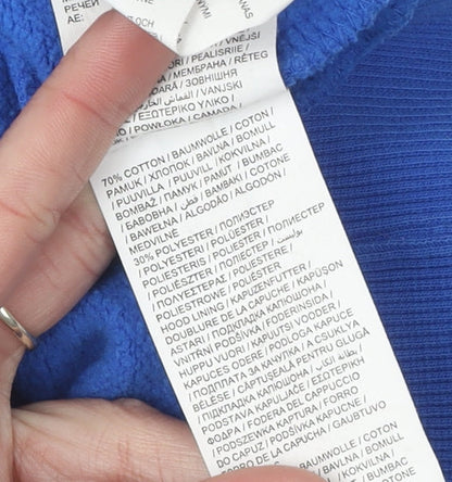 Brand and care label for Puma boys’ blue hoodie pullover, size 14, graphic design