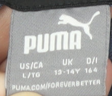 Close-up detail of Puma girls’ blue 13-14 years pullover hoodie