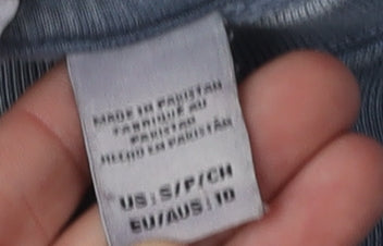 Close-up detail of Quiksilver boys’ blue crew neck sweatshirt s