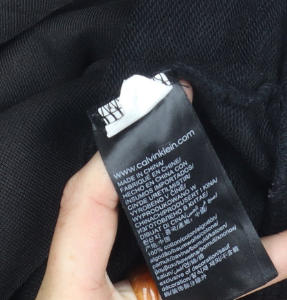 Brand and care label for Calvin Klein girls’ black pullover hoodie, size 16