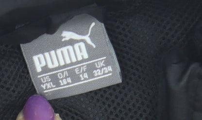 Close-up detail of Puma boys’ black basic jacket, 14 years, logo accents
