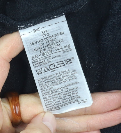 Close-up detail of Gap girls’ black pullover sweatshirt, size 14y, logo accent