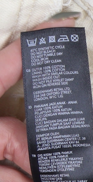 Brand and care label for Mantary girls’ beige denim jacket, size 7, cotton