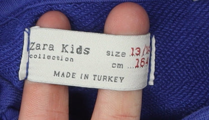 Close-up detail of Zara Kids boys’ blue bart hoodie 13-14 years graphic pullover
