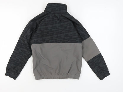 Back view of Adidas boys’ black track jacket, geometric, size 7, autumn wear