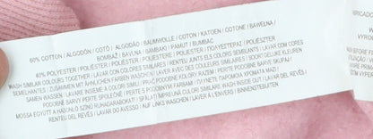 Brand and care label for Disney at Primark girls’ pink stitch pullover sweatshirt 13-14y