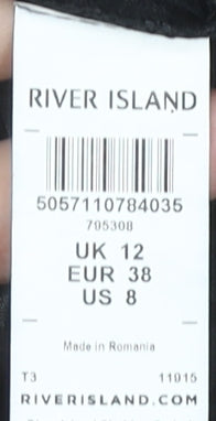 Close-up detail of River Island Black Animal Print Wrap Blouse, size 12