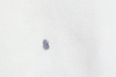 Close-up detail of Nike girls’ beige pullover hoodie with pink logo, size S