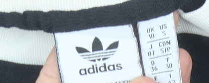 Close-up detail of Adidas Women's Black T-Shirt, size 10, Basic Style