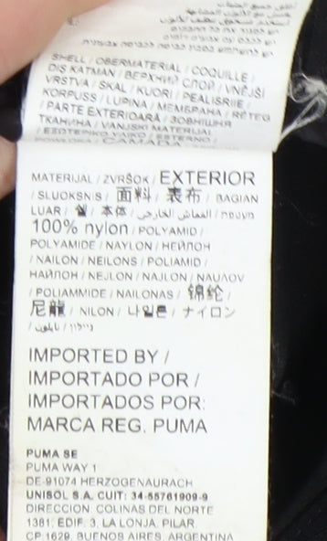 Brand and care label for Puma boys’ black track jacket, size 14