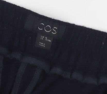 Brand and care label for COS Women's Black Wool Trousers, size 4
