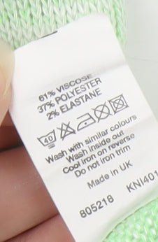 Close-up detail of Disney girls’ green tank top - 11-12 years, cartoon graphic