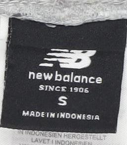 Close-up detail of New Balance Men's Grey Jogger Tracksuit Pants, size S