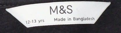 Brand and care label for Marks & Spencer girls’ black sweatshirt 12-13 yrs