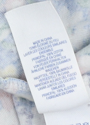 Close-up detail of Cath Kidston girls’' blue floral long sleeve dress 5-6 yrs