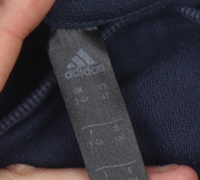 Close-up detail of Adidas boys’ blue pullover sweatshirt 4 years logo casual