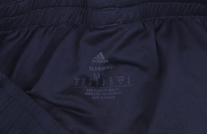 Close-up detail of Adidas boys’ blue athletic running shorts m