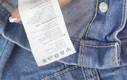 Brand and care label for Mantaray girls’ blue denim a-line skirt, age 9, casual & stylish