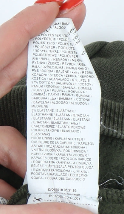 Brand and care label for Puma boys’ green pullover hoodie - 9-10 years