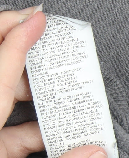 Close-up detail of Puma girls’ grey pullover hoodie xl graphic print