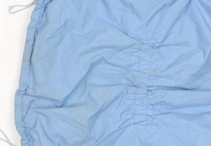 Close-up detail of Peter Storm girls’ blue mid-length waterproof jacket