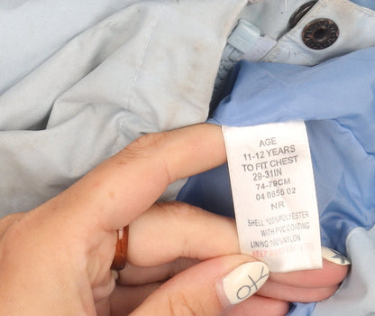 Brand and care label for Peter Storm girls’ blue mid-length waterproof jacket