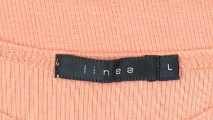 Close-up detail of Linea Women's Orange Long Sleeve T-Shirt, size L