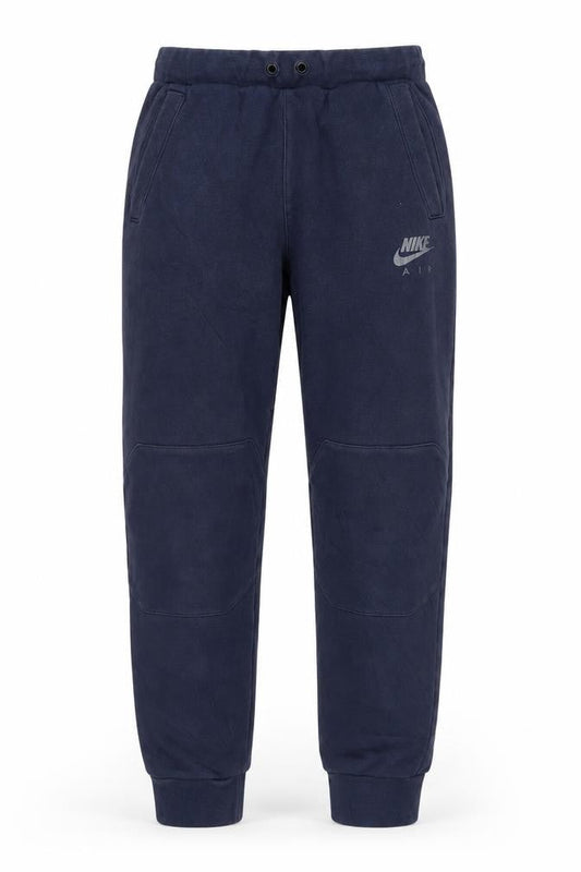 Front view of Nike boys’ blue jogger trousers xl