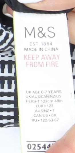 Close-up detail of Marks & Spencer girls’ black check puffer jacket 7 years