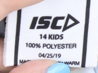 Close-up detail of ISC boys’ green blue graphic print t-shirt, size 14