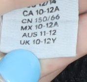 Brand and care label for H&M girls’ black athletic shorts 10-12y