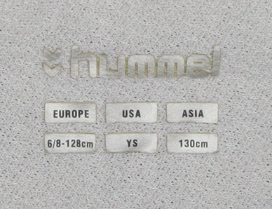 Close-up detail of Hummel boys’ black athletic shorts, size 8, gym & training