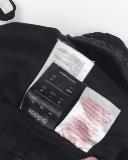 Close-up detail of Adidas boys’ black xl athletic shorts with stripes