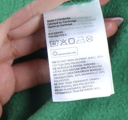 Close-up detail of H&M girls’ green graphic sweatshirt, size 12-13y pullover