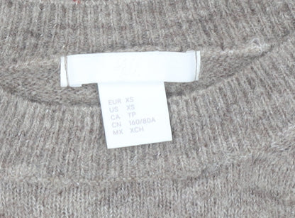 Close-up detail of H&M women’s beige round neck jumper xs