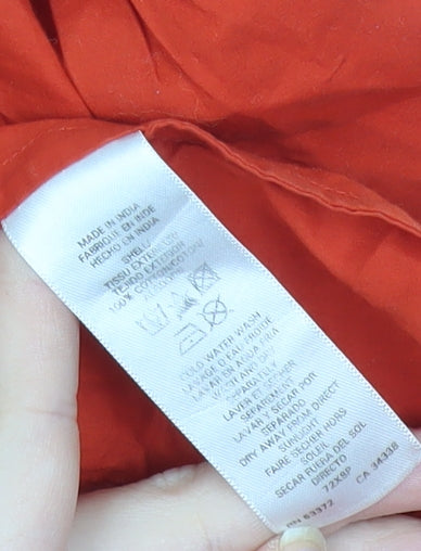 Brand and care label for French Connection women’s red cotton tunic blouse, size UK 10