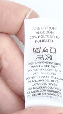 Brand and care label for Dunnes girls’ green pullover sweatshirt 4-5 years nature print