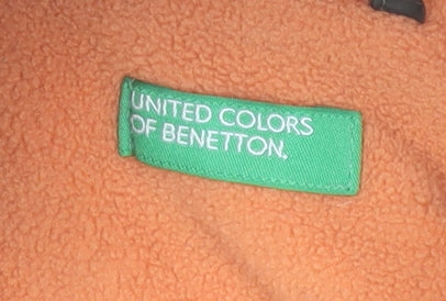 Brand and care label for United Colors of Benetton boys’ green hooded puffer jacket, size 6-7, years