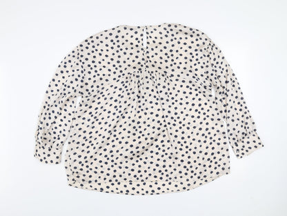 Close-up detail of Gallery women’s ivory polka dot long sleeve tunic blouse, size UK 16