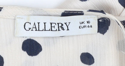 Brand and care label for Gallery women’s ivory polka dot long sleeve tunic blouse, size UK 16