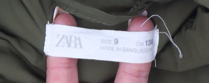 Brand and care label for Zara girls’ green mid-length padded basic jacket, size 9, years