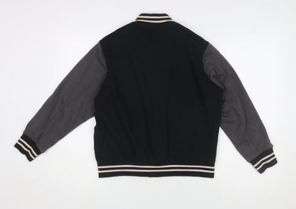 Close-up detail of Uniqlo boys’ black varsity jacket 11-12 years cotton blend button casual