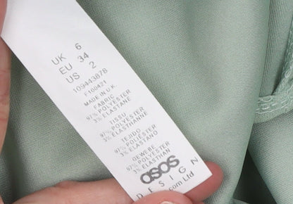 Brand and care label for ASOS DESIGN Women’s Green Double-Breasted Long Blazer Jacket, size UK 6