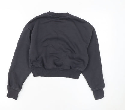 Close-up detail of Primark girls’ black inside out sadness pullover sweatshirt 9-10 years