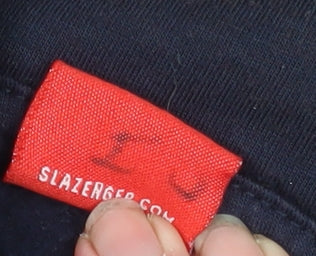 Brand and care label for Slazenger boys’ navy blue hooded zip-up fleece jacket 11-12 years