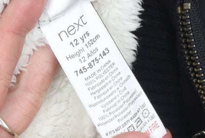 Brand and care label for Next girls’ black bomber jacket 12 years polyester lined full zip