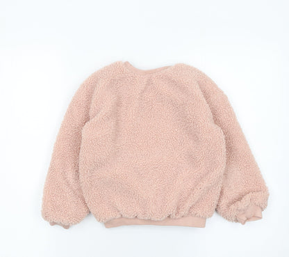 Close-up detail of Missguided girls’ pink fleece pullover sweatshirt 6-7 years