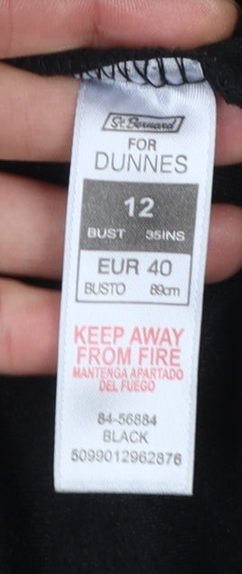 Brand and care label for Dunnes women’s black velvet mid-length jacket, size UK 12