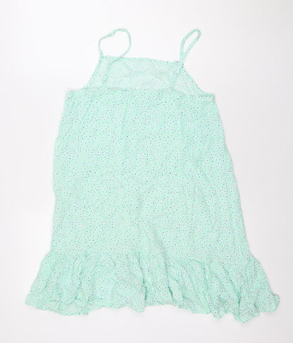 Close-up detail of Dunnes girls’ green polka dot viscose trapeze dress 9-10 years