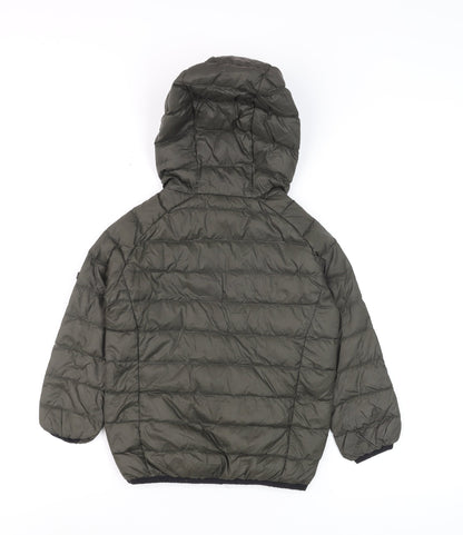 Close-up detail of TOG24 boys’ green hooded puffer jacket 6 years lightweight down coat